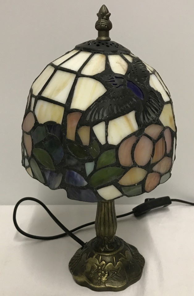 A small Tiffany style table lamp.