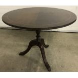 A vintage circular topped occasional table with inlaid banding to top.