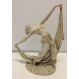 A large resin figurine of a dancing lady.
