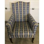 Edwardian ladies armchair on tapered legs with ceramic castors.