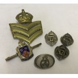 6 assorted military badges to include 3 Territorial Army lapel badges.