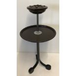 Art Deco tripod footed smokers stand with bakelite ashtray and shelf.