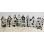 A collection of 8 Blue Delft KLM BOLS ceramic miniature houses.