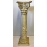 A cream coloured resin classical column design jardiniere stand.