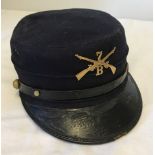 Vintage American Blue cap with brass crossed riffles badge marked 7B