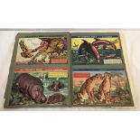 A vintage scrap book containing a quantity of animal pictures and facts from "This Wonderful World".