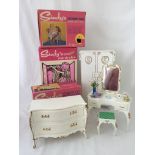 A boxed Sindy chest of drawers together with a boxed wardrobe and a boxed dressing table and stool.