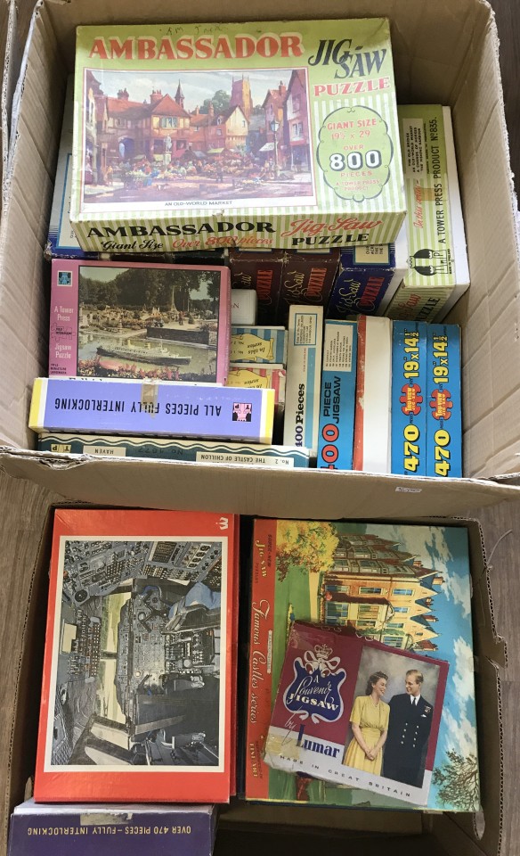 2 boxes of vintage jigsaw puzzles.