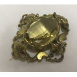 A vintage large ornate 9ct gold & citrine brooch.