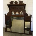 A large vintage wood framed overmantle mirror.