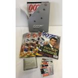 A collection of 007 James Bond magazine with collectors cards.