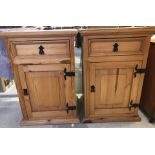 A pair of modern pine bedside cabinets with single drawer and cupboard to front.