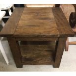 A modern dark wood square shaped side table with lower shelf.