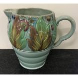 A Clarice Cliff Newport pottery Celtic leaf and berry pattern flower jug in green colourway.