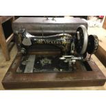 A vintage wooden cased Vickers sewing machine.