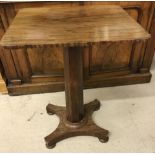 A small square topped occassional table with feather banding veneer on a pedestal stand.