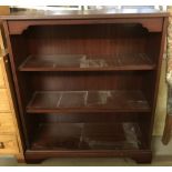 A modern mahogany coloured 3 shelf bookcase.