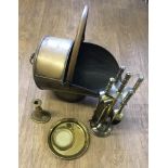 A brass coal scuttle.