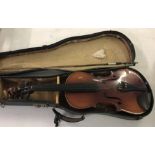 A cased violin with bow in need of attention.