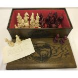 A large resin chess set with pieces based on Louis XIV, the Sun King.