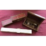 A boxed reproduction angle sextant together with a cased vintage slide rule.