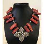 Large coral and white metal necklace.