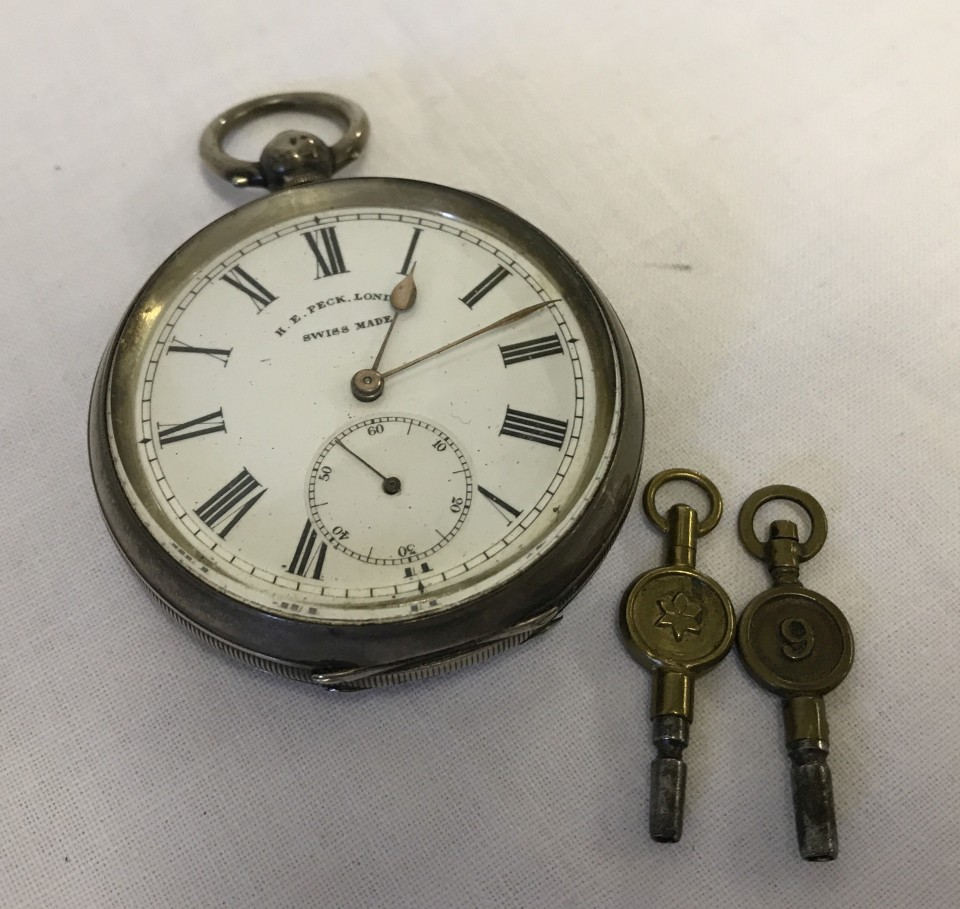 A vintage 935 silver cased pocket watch by H.E. Peck, London.