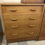 A light oak G Plan 4 drawer chest. Top drawer has compartments.