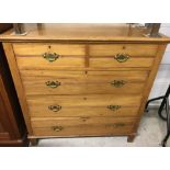 A vintage pine 2 over 3 chest of drawers.