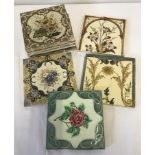 A collection of 8 Victorian ceramic tiles with floral design.