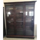 An Georgian large dark wood glass fronted 3 door display cabinet.