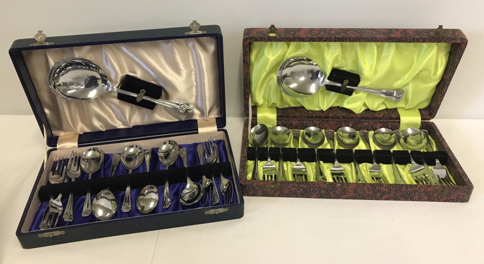 2 cased sets of silver plate dessert cutlery with serving spoons.
