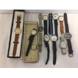 A small collection of men's watches and straps.