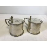 A pair of Edwardian Elkington & Co. silver plated lidded salts.