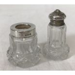 A cut glass silver topped salt pot together with a matching toothpick holder with silver rim.
