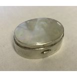 A 925 silver pill box with mother of pearl lid.