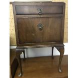 A vintage dark wood cabriole leg bedside cabinet.