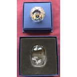 A boxed Swarovski Portsmouth paperweight together with a boxed small horse etched paperweight.