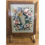 A vintage light wood and glass front tapestry tilt top firescreen / small table.