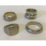 4 chunky silver rings to include spinner rings.