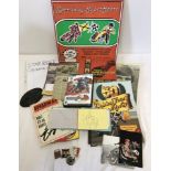 A box of assorted speedway items.