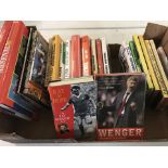 A box of books relating to Arsenal Football club.