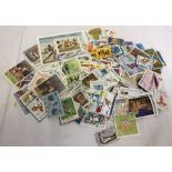 A collection of Olympic themed loose world stamps.