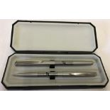 A cased 2002 - 3 Arsenal FC "Back to Back" FA cup winners pencil and pen set.