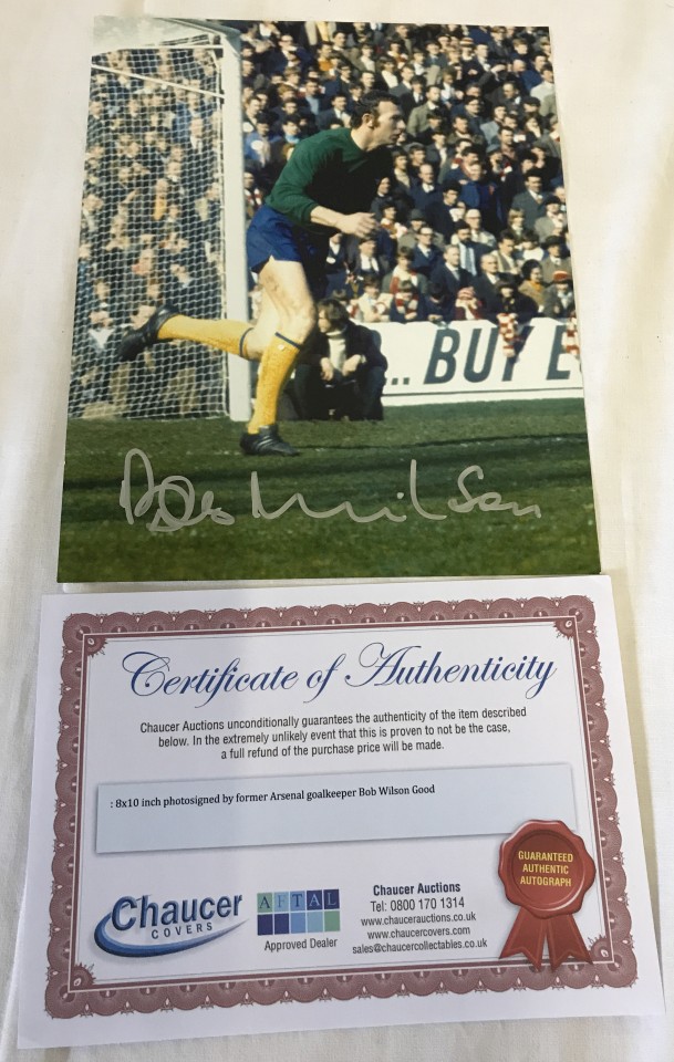 A signed photograph of Bob Wilson, Arsenal's 1971 double winning goalkeeper in action.