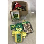 A box of football related items to include England hats and Norwich City clock and mirror.
