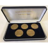 A boxed set of golden bronze medallions to commemorate the 1988 Winter Olympics in Calgary, Canada.