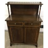 A vintage 2 door, 2 drawer cabinet. Upper shelf with brass gallery rail.