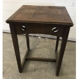 An Arts & Crafts square topped oak occasional table.