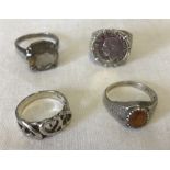 4 silver dress rings.